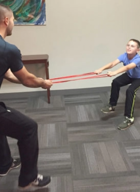 Child exercising with Billy